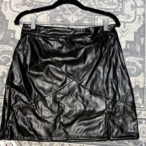 Sleek Black Leather Mini Skirt. Size medium